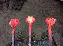 Forging red hot metal to create a Ram’s Head Poker or Paper Knife